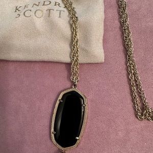Kendra Scott gold pendant necklace with black stone.  Long necklace.